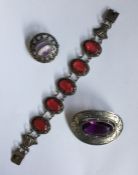 A bag containing Scottish silver brooch, bracelet