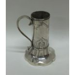 A novelty tapering silver mug with engraved decora