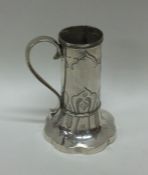 A novelty tapering silver mug with engraved decora