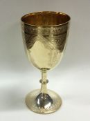 A large silver gilt engraved goblet on spreading b