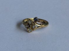 An 18 carat sapphire and diamond ring in the form