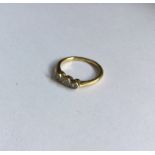 An 18 carat diamond mounted three stone ring in ru