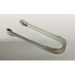 A pair of George III silver bright cut sugar tongs