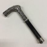 A good silver mounted walking stick with embossed