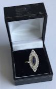 An attractive sapphire and diamond marquise shaped