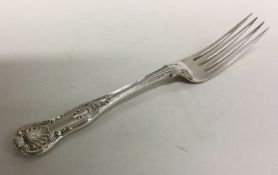 A heavy Kings' pattern silver table fork. London.