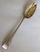 A George III silver tablespoon with gilt bowl. Lon