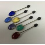 A heavy set of six silver and enamelled teaspoons.