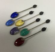 A heavy set of six silver and enamelled teaspoons.