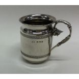 An attractive silver christening cup decorated wit