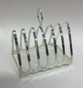 A large silver seven bar toast rack. Birmingham. B