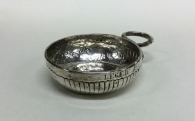 An Antique French silver wine taster of typical fo