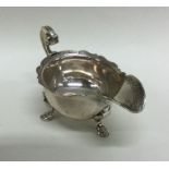 A rare George II silver cream boat with crested ar