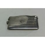 A large engine turned silver card case with hinged
