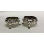 A pair of Victorian chased silver salts with flora