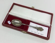 A Georgian style silver spoon contained within a f