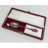 A Georgian style silver spoon contained within a f