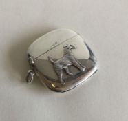 An unusual silver vesta case mounted with a dog wi