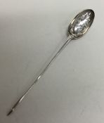 A large silver and rat tail mote spoon with scroll