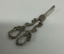 A fine pair of silver grape scissors with cast han