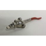 A Georgian silver bright cut rattle together with