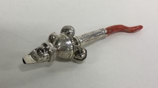 A Georgian silver bright cut rattle together with