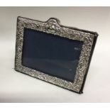 An Edwardian silver picture frame. London. Est. £2