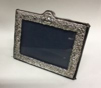 An Edwardian silver picture frame. London. Est. £2