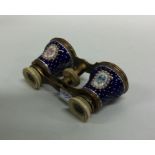 A pair of royal blue enamelled opera glasses with