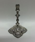 A Victorian silver taper stick of Georgian design.