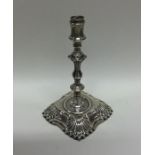 A Victorian silver taper stick of Georgian design.