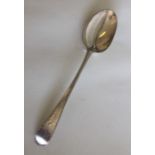A George III silver spoon with crested decoration.