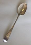 A George III silver spoon with crested decoration.