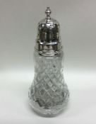 An Edwardian silver mounted glass sugar caster. Bi