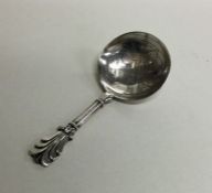 A Victorian silver caddy spoon with engraved bowl.
