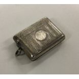 An engine turned silver vesta case with hinged top
