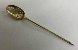 A large silver gilt mote spoon with pierced bowl.