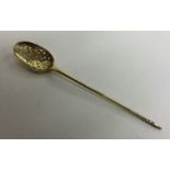 A large silver gilt mote spoon with pierced bowl.