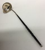 A Georgian silver toddy ladle with whalebone handl