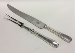 A silver two piece carving set. London 1998. By Ma