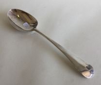 A George III silver tablespoon with scroll back. L