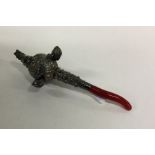 A silver rattle together with matching teether emb