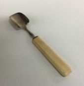 A Georgian silver cheese scoop with ivory handle.