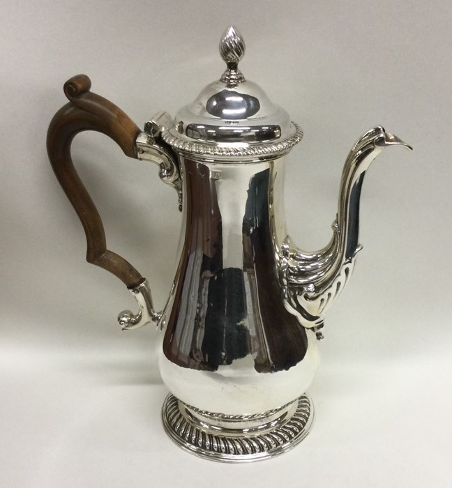 A Georgian silver baluster shaped coffee pot with