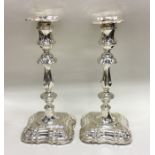 A good pair of Edwardian silver candlesticks of typical