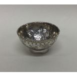 A small attractive silver bowl of Chinese design.