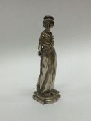 A heavy figure of a lady in long sweeping dress. e