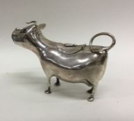 An Antique silver cow creamer of typical form with