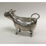 An Antique silver cow creamer of typical form with