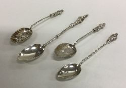 A collection of four heavy silver Apostle top spoo